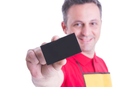 Selective focus on visit or business card in supermarket merchandiser hand with advertising areaの写真素材