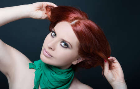 Fashion portrait of beautiful girl with red hair and bright make up