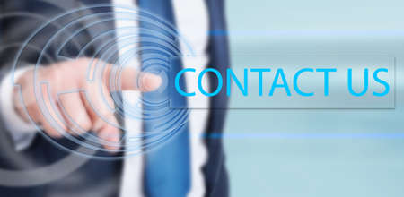 Businessman hand touching contact us button on touchscreen interface in closeup view