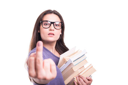 Bad rude young woman with school books showing middle finger on white background