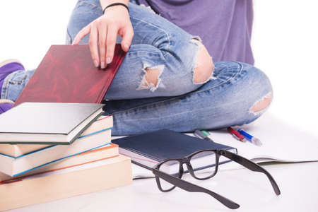 Closeup view of student legs and books learning for next day testの写真素材
