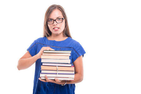 Portrait of handsome student girl holding bunch of books isolated on white background
