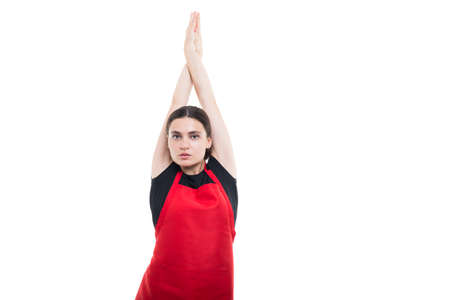 Beautiful girl employee stretching her arms up and relaxing in her work break