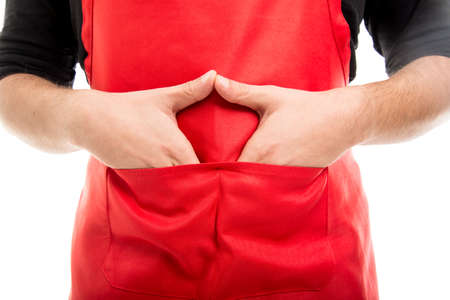 Close-up of  supermarket employer with hands in pockets isolated on white backgroundの写真素材