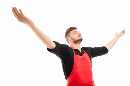 Male supermarket employer holding arms wide open looking powerful isolated on white backgroundの写真素材
