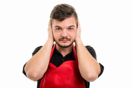 Male supermarket employer covering ears like not hearing or monkey concept isolated on white...