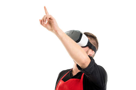 Male supermarket employer pointing wearing vr goggles isolated on white background with copyspace...