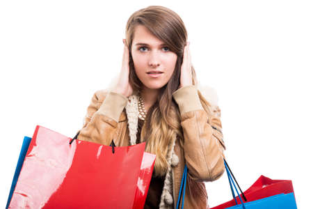 Beautiful fashion woman at shopping doing hear no evil gesture sign