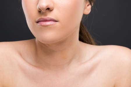 Close-up of female shoulder and mouth as beauty and wellness conceptの写真素材