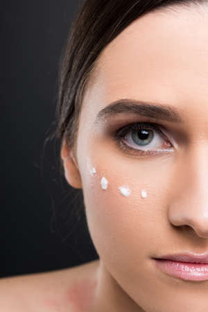 Half portrait of female model face with moisturized cream in closeup viewの写真素材