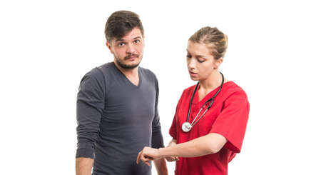 Male patient and female doctor showing being late gestureの写真素材