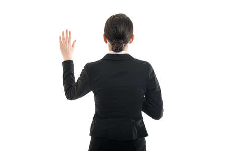 Back view of female flight attendant taking oath isolated on white backgroundの写真素材