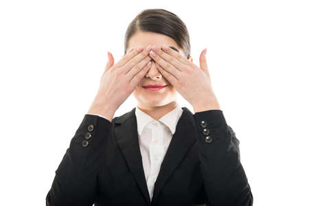 Beautiful female flight attendant covering her eyes isolated on white background