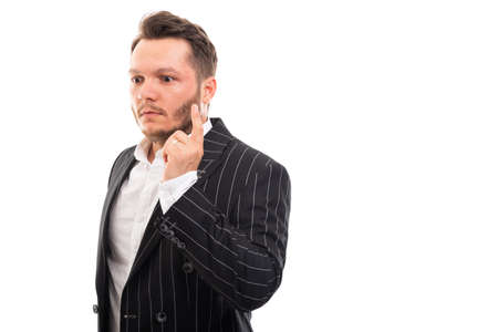 Portrait of business man showing idea gesture isolated on white background with copyspace advertising areaの写真素材