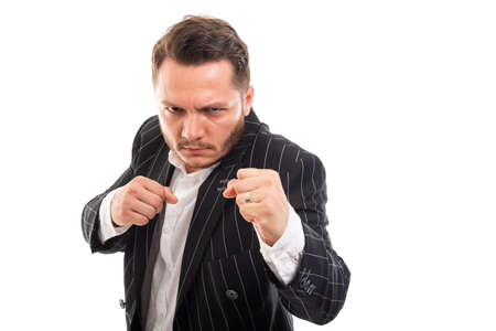 Portrait of business man showing double fist like fighting isolated on white background with copyspace advertising areaの写真素材