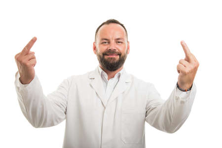 Portrait of male doctor showing double middle finger gesture isolated on white backgroundの写真素材