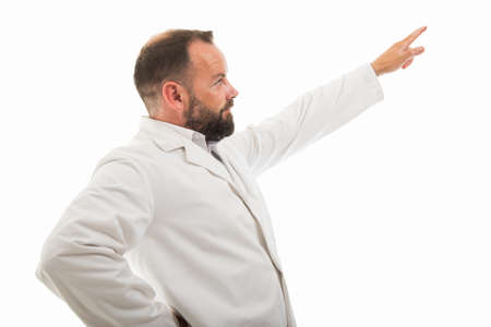 side view of male doctor pointing  with finger isolated on white background with copyspace...