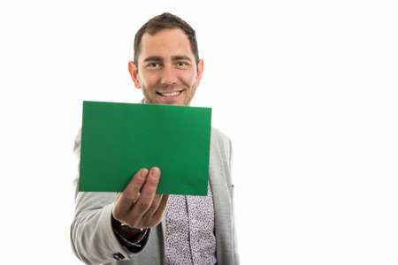 Portrait of business man showing green card board isolated on white background with copyspace...