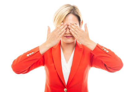 Young pretty business woman covering eyes gesture isolated on white backgroundの写真素材