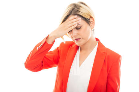 Young pretty business woman showing headache gesture isolated on white backgroundの写真素材