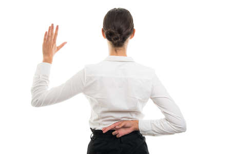 Back view of young pretty bussines woman showing fake oath gesture isolated on white background with...
