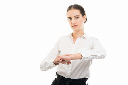 Portrait of young pretty business woman showing late gesture isolated on white background with copy...
