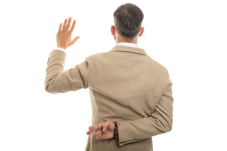 Back view of man wearing fashionable clothes taking fake oath isolated on white backgroundの写真素材