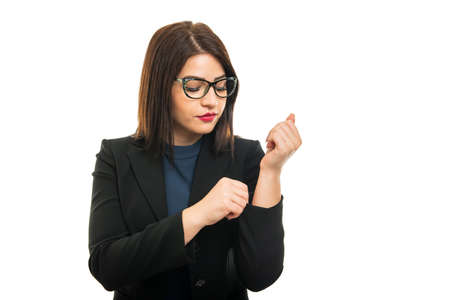 Portrait of business girl wearing glasses arranging sleeve isolated on white background with copy space advertising areaの写真素材