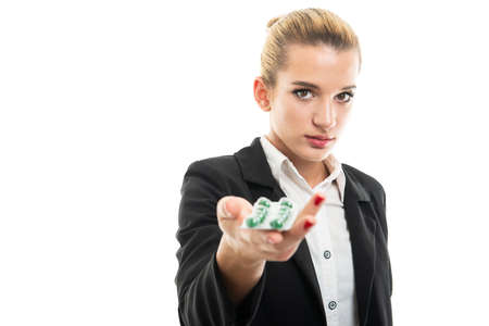 Young female assistant manager handing blister of pills isolated on white background with copy space advertising areaの写真素材
