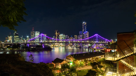 Story bridge illuminating brisbane skyline at night from kangaroo point lookoutの写真素材