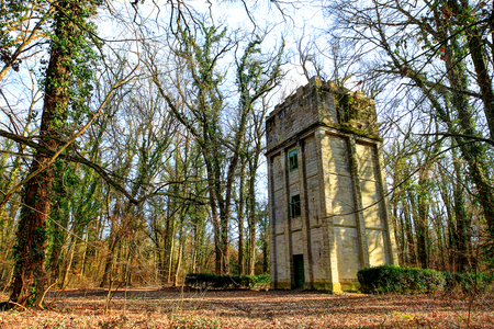 Deserted water tower in the forest