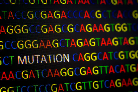 DNA sequence with colored letters on black background containing mutationの写真素材