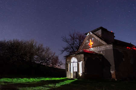 Stars over an old abandoned rural churchの写真素材