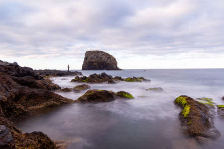 Fisherman on the Atlantic Ocean coast, Madeira island, Portugalの写真素材