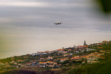 Plane approaching landing on Madeira airport, Portugalの写真素材