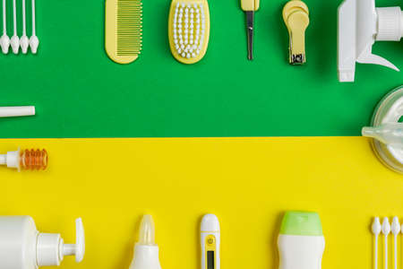 Pediatric micro enemas on green and yellow backgroundの写真素材