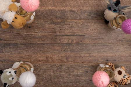 Sheep, donkey and dog toys on wooden background
