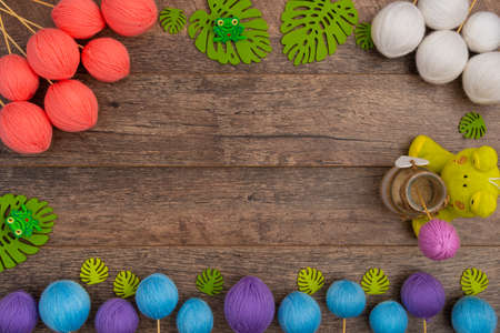 Felt leafs and yarn balls, with copy space