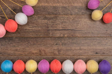 Colorful wool balls on sticks, top view.の写真素材