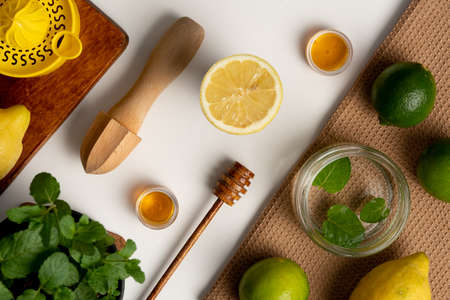 Lemon and citrus juicer on wooden boardの写真素材