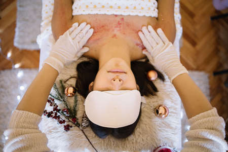 Young girl having scrub therapy at SPA centerの写真素材