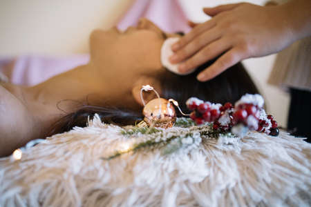 Frosty pine branch on focus at beauty salonの写真素材