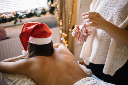Girl lying on massage table ready for massageの写真素材