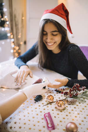 Happy woman having a manicure at nail salonの写真素材