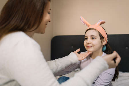Mother and little girl with bunny earsの写真素材