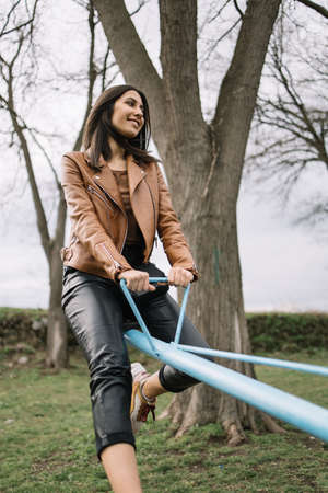 Young girl enjoying children facilities in playground