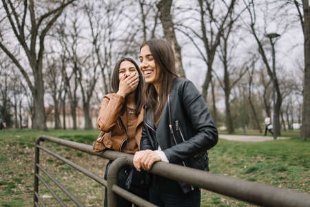 Beautiful girls laughing and having fun outdoorsの写真素材