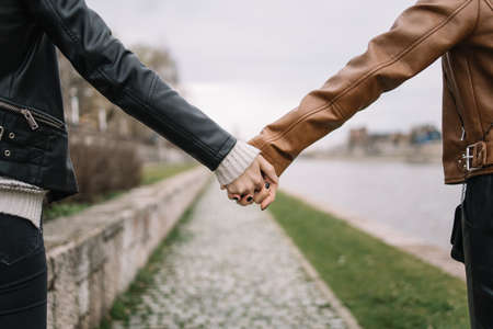 Close-up view of female hands clasped outdoorの写真素材