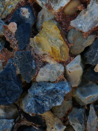 Various types of colorful stones in different shapes