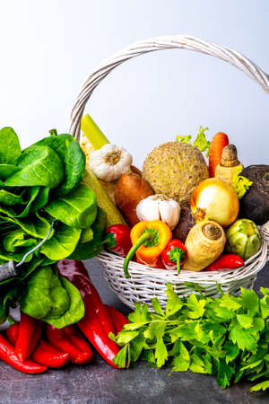 Wooden basket full of fresh and delicious greensの写真素材
